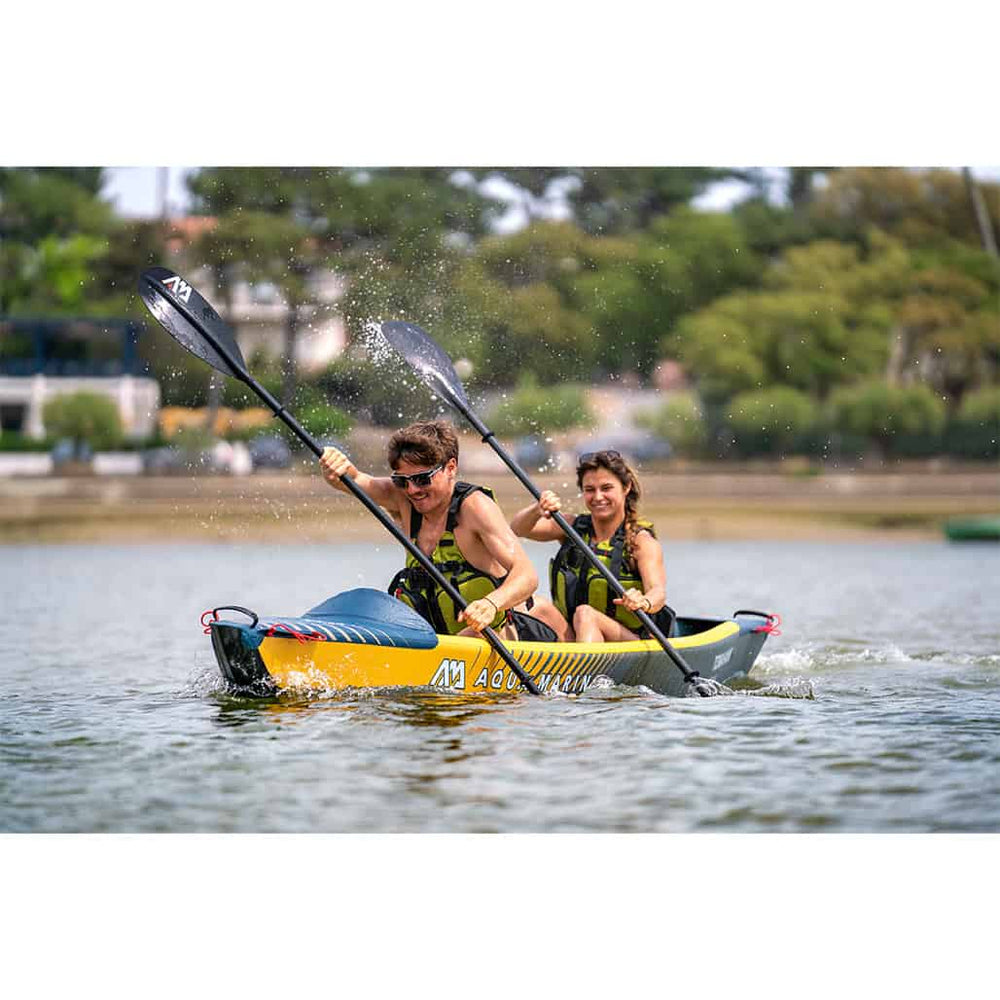Two paddlers enjoying an Aqua Marina kayak on the water